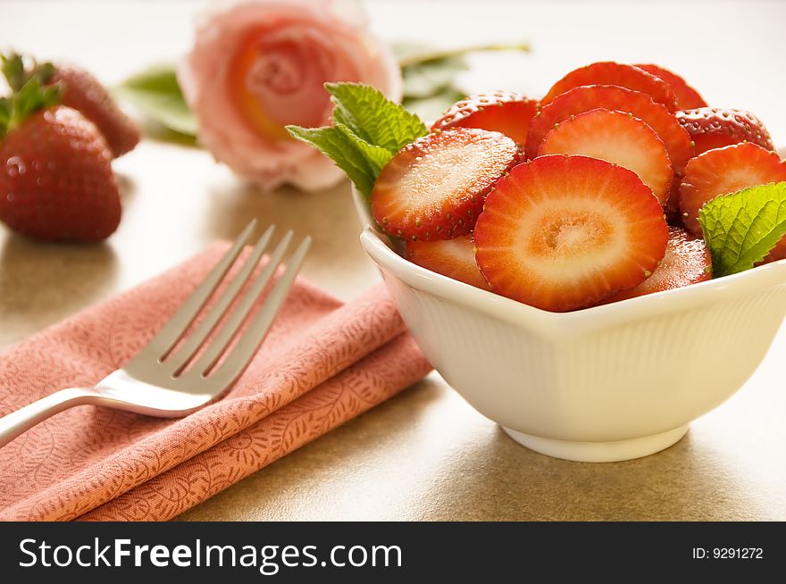 Closeup of sliced strawberries in bowl with shallow DOF. Closeup of sliced strawberries in bowl with shallow DOF.