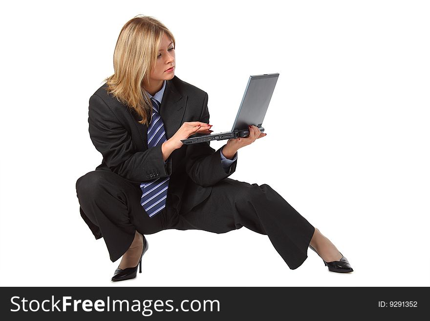 Young pretty businesswoman in big suit with laptop on white. Young pretty businesswoman in big suit with laptop on white