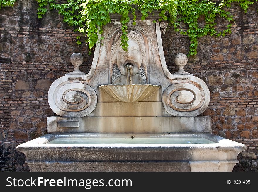 Old fountain in Trastevere in Rome