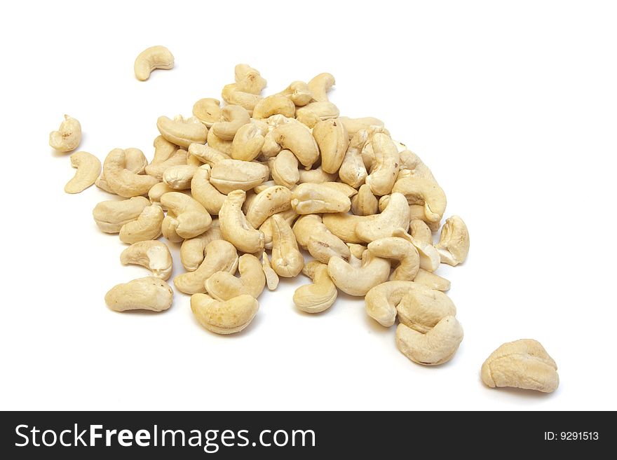 Heap of cashew isolated on white with dof effect. Heap of cashew isolated on white with dof effect