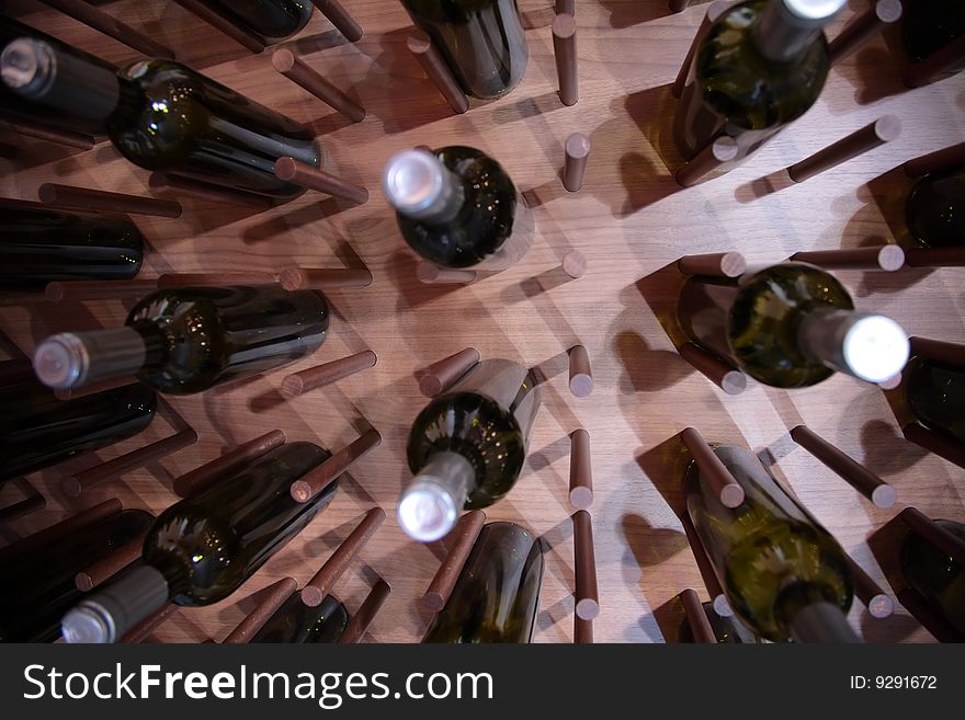 Wine bottles on wall, focus on wall