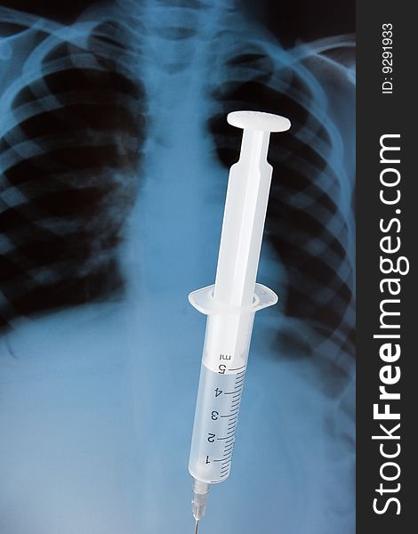 Syringe on baby x-ray background