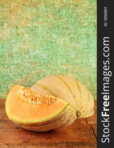 Sliced Cantaloupe On A Wooden Table