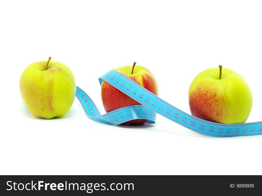 Yellow apple and measuring tape on white