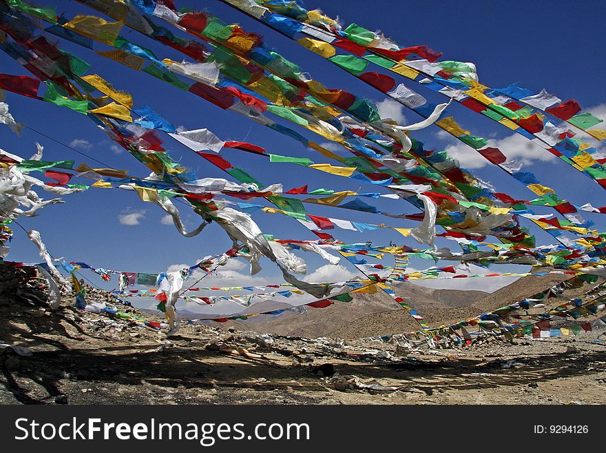 Buddhist flags waving in the himalaya