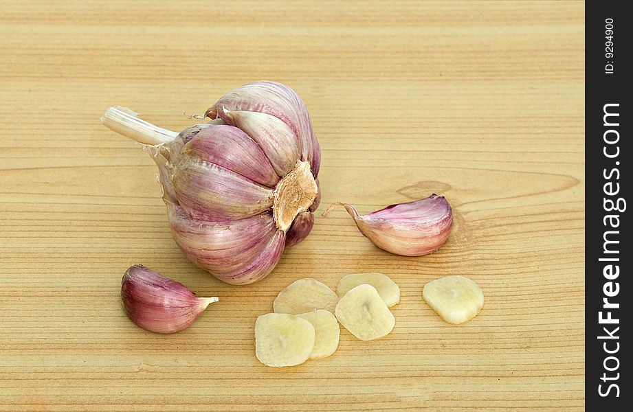 Garlic and cloves on desk