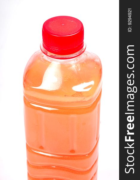 Orange juice bottle isolated on white.