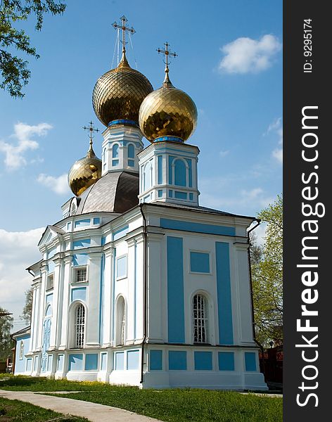 The Christian orthodox temple on background of blue sky. The Christian orthodox temple on background of blue sky