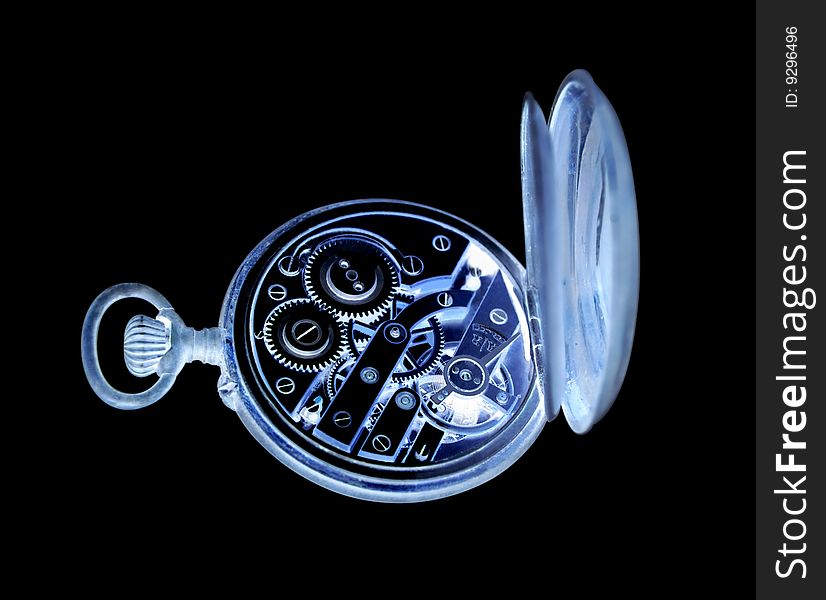 Inverted old watch on a black background with clipping path.