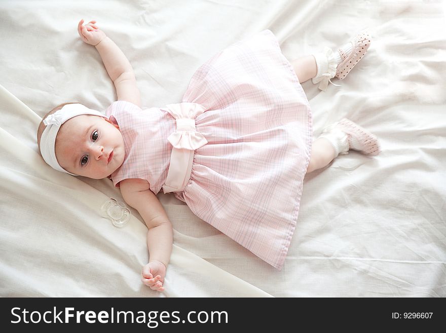 Beautiful newborn girl in beautiful pink dress