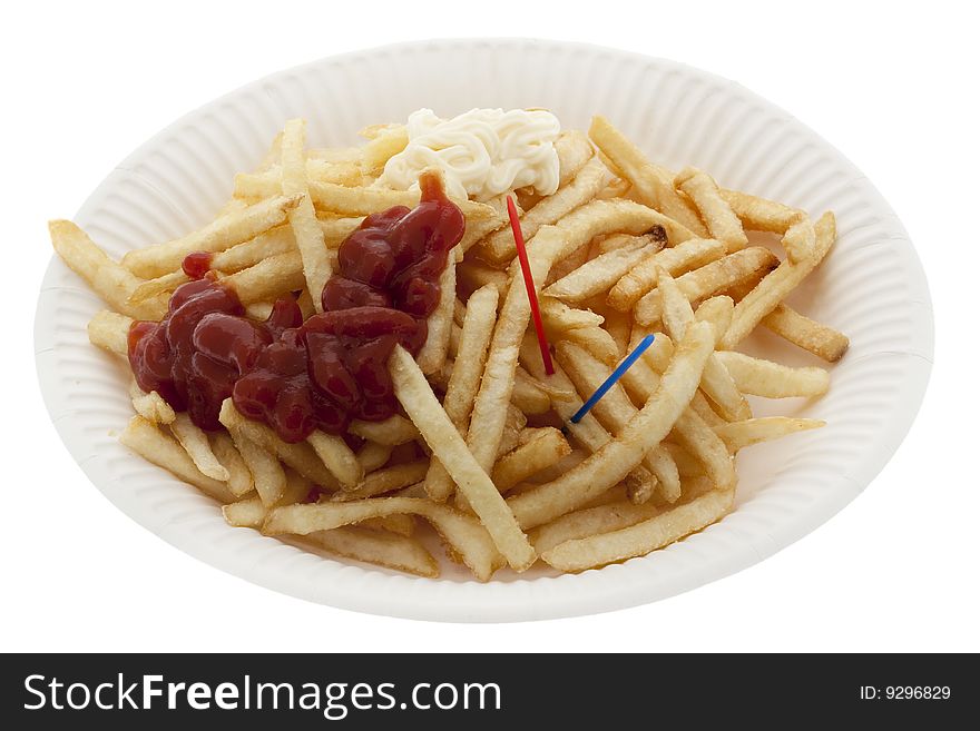 Pommes frites with ketchup and mayonnaise on paper plates