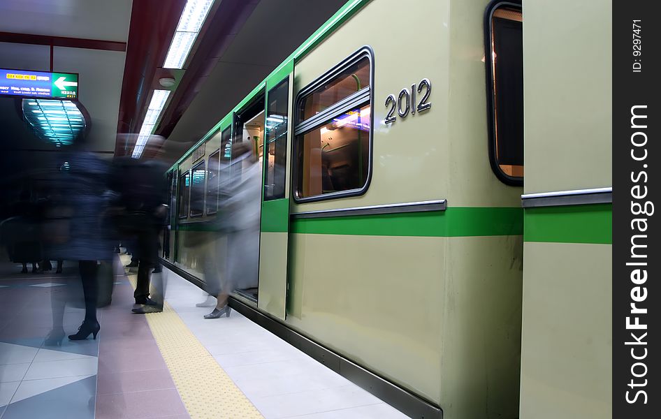 Motion-blur passengers at subway station