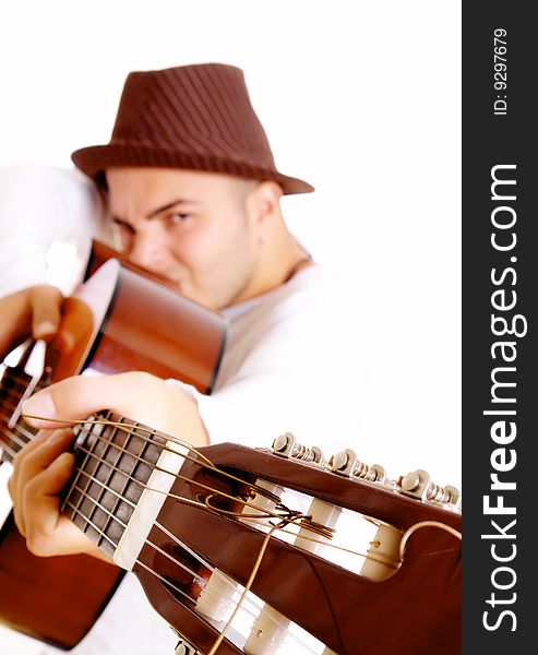 Man with guitar looking at camera. Isolated image. Man with guitar looking at camera. Isolated image