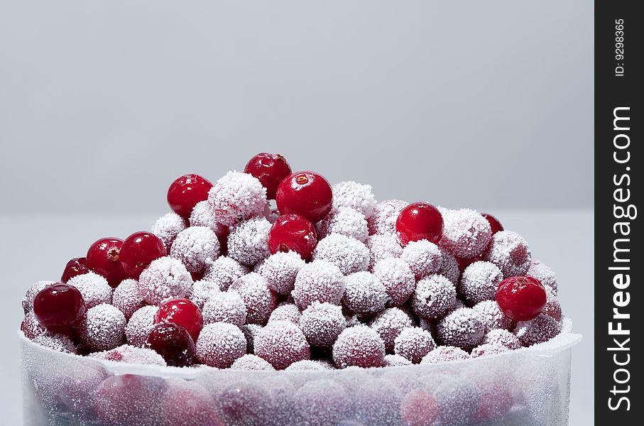 Frozen cranberry on a gray background