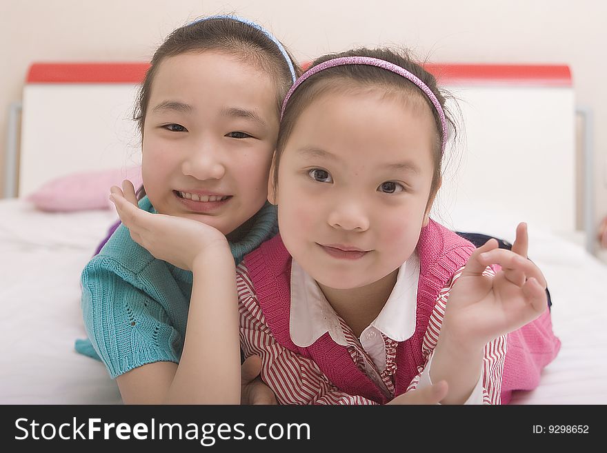 Two little girls play game together. Two little girls play game together.