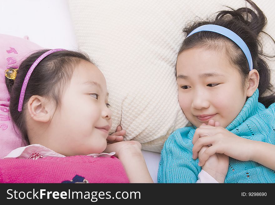 Two little girls play game together. Two little girls play game together.