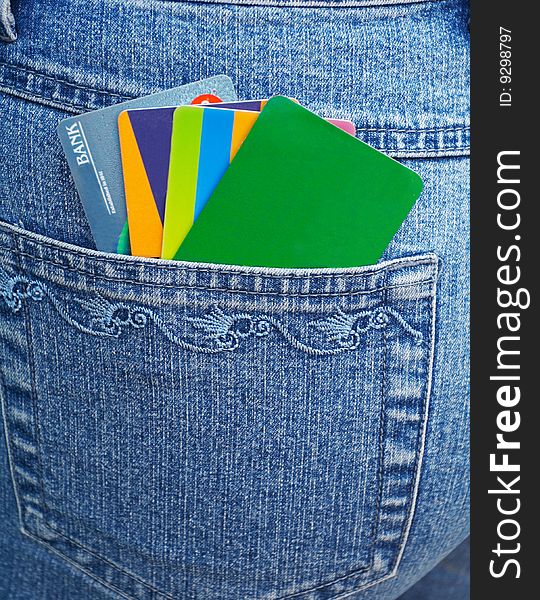 Color banking cards and  blue jeans
