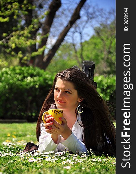 Young girl drinking coffee