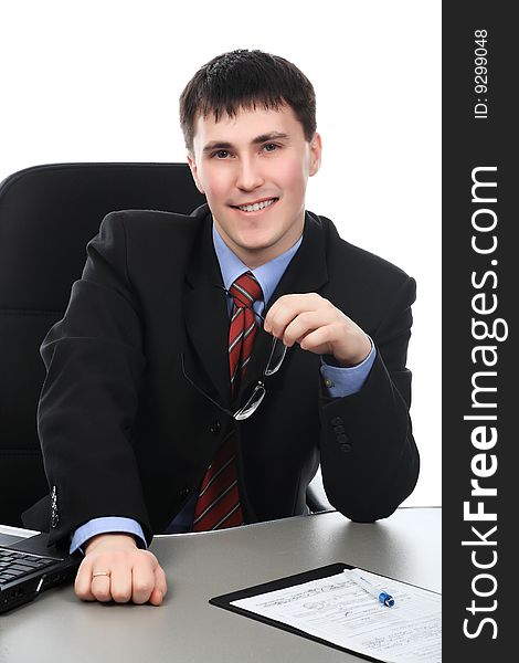 Business theme: handsome businessman in a work process. Business theme: handsome businessman in a work process.