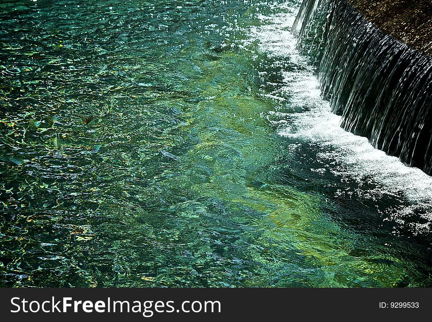 Breathtaking beautiful impressionistic image of waterfall  with a lot of space for copy or graphics