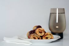 Rolled Pancakes With Strawberry Jam And A Glass Of Water Royalty Free Stock Image