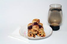 Rolled Pancakes With Strawberry Jam And A Glass Of Water Stock Image