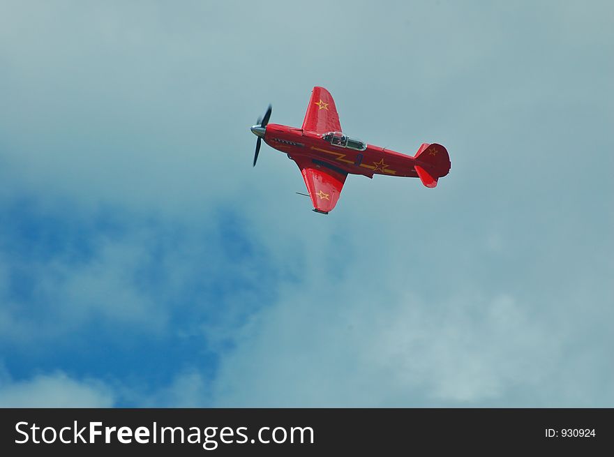 Russian Yak fighter performing at an airshow. Russian Yak fighter performing at an airshow