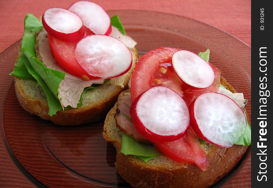 Fresh spring time sandwiches:

bread, butter, lettuce, pork, tomato, radish