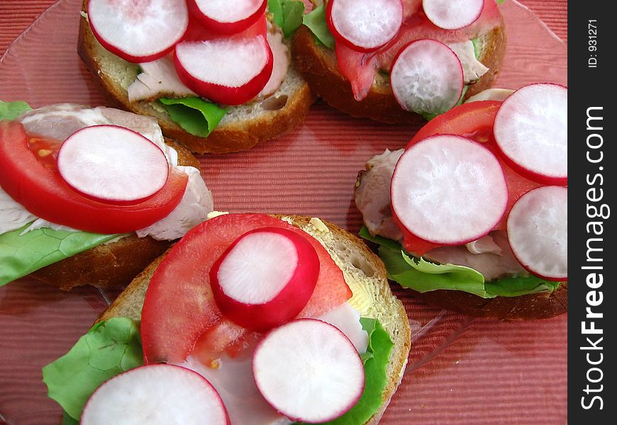 Fresh spring time sandwiches:

bread, butter, lettuce, pork, tomato, radish