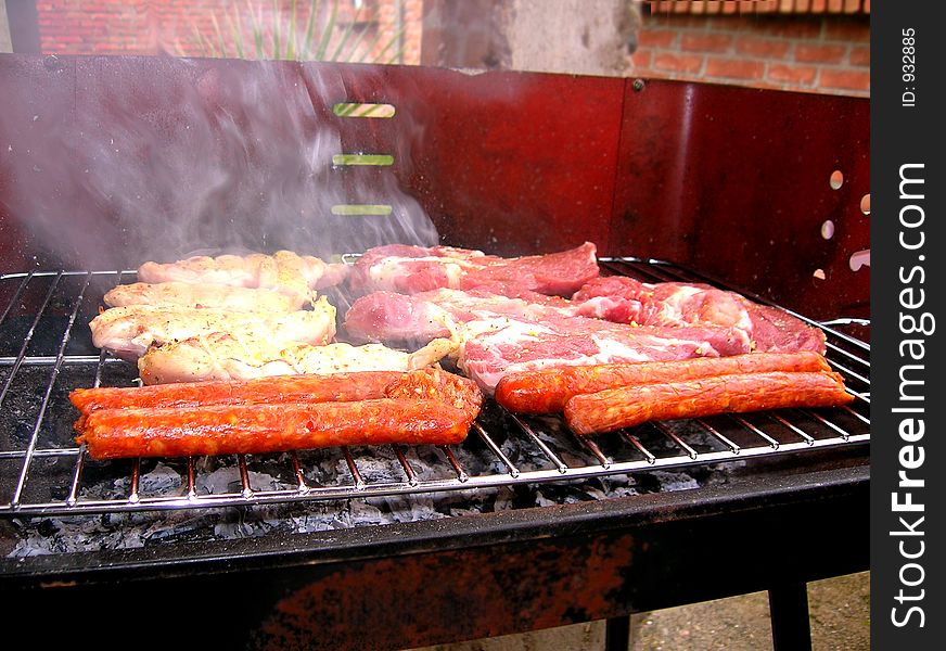 Barbecue, meat on the grille and smoke