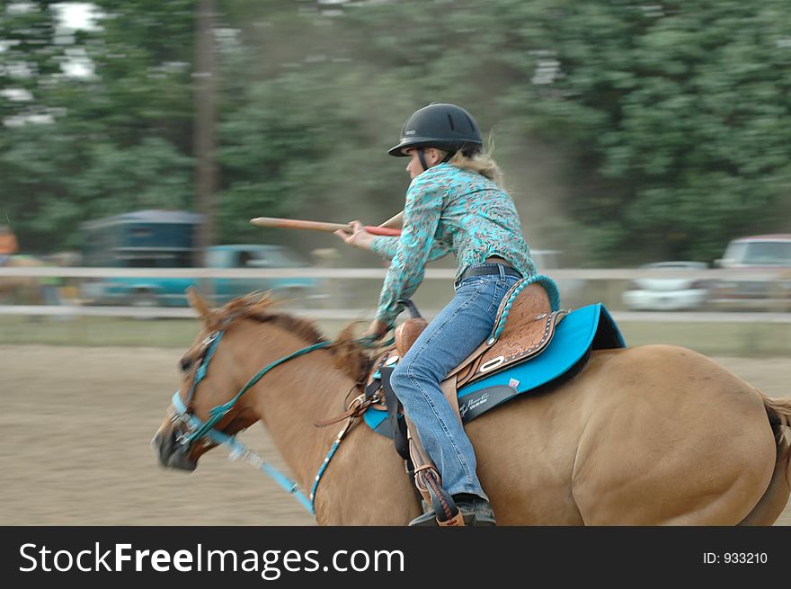 A girl Placing a flag at a horse show with motion blur. A girl Placing a flag at a horse show with motion blur.