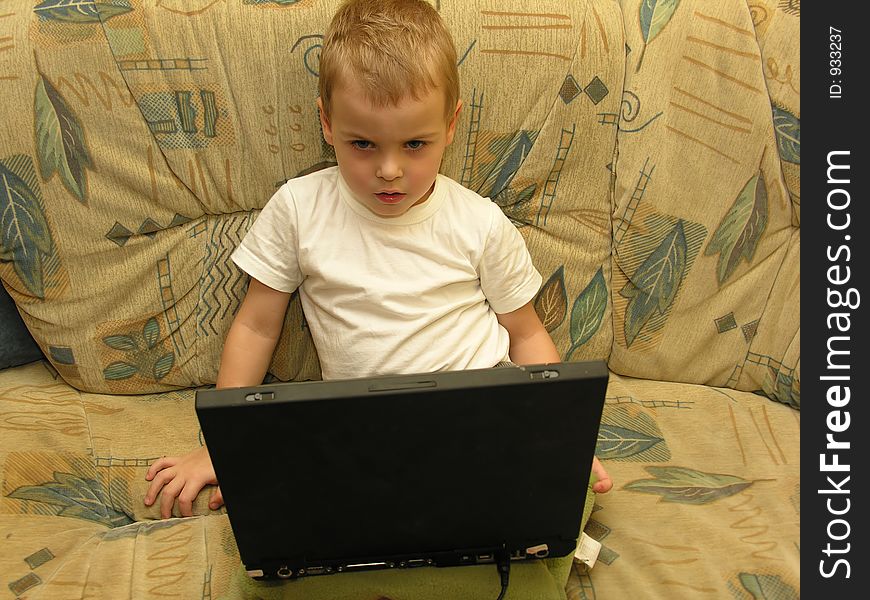 Boy with notebook at home