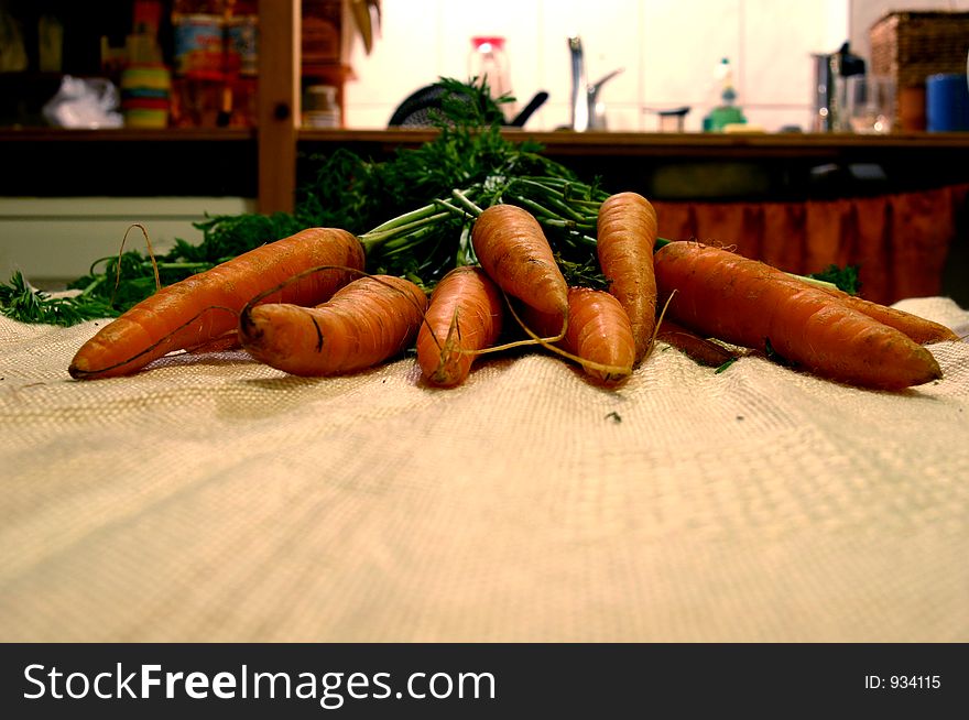Carrots with stems on a Table