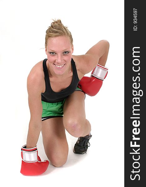 Young attractive blonde woman in boxing gloves. Young attractive blonde woman in boxing gloves.