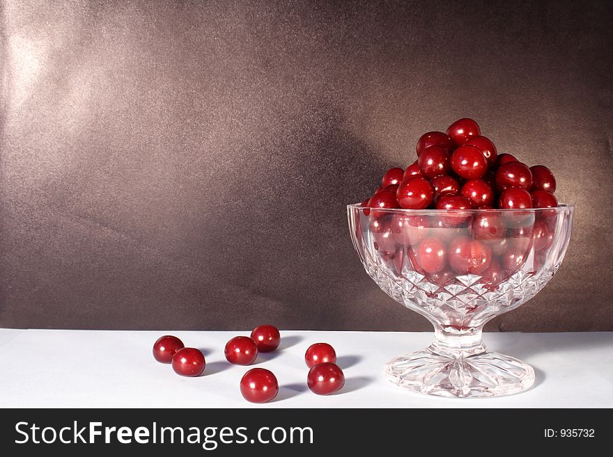 A brown frame with cherries. A brown frame with cherries