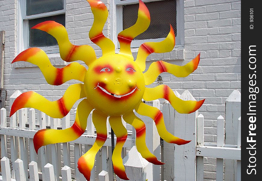 Hand crafted item  made to look like a hot 
smiling sun.