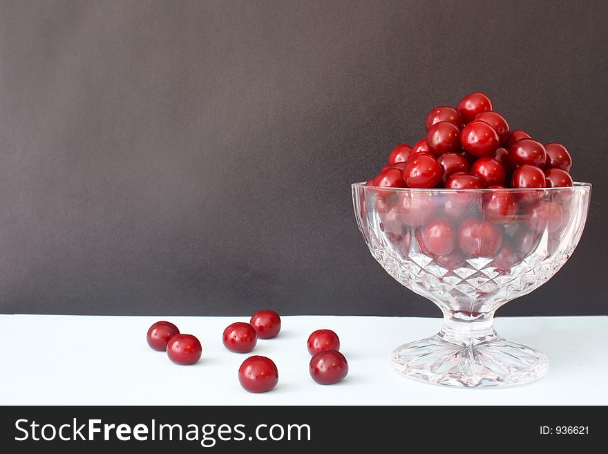 A brown frame with cherries. A brown frame with cherries