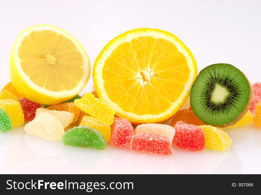 Fruits and jelly on white background