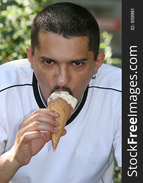Portrait of a man eating ice cream. Portrait of a man eating ice cream