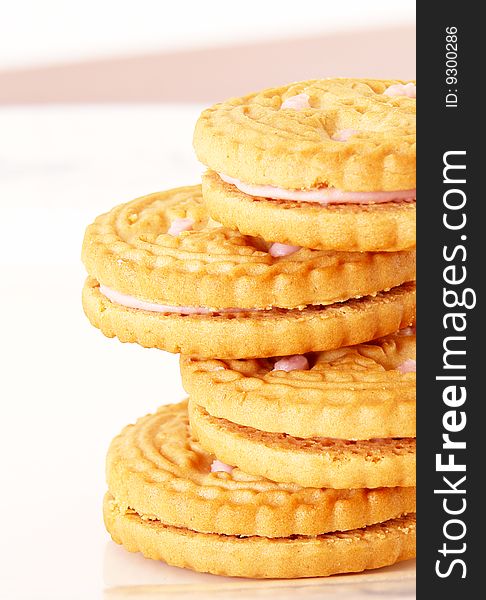 Sweet cookies with cream on white background