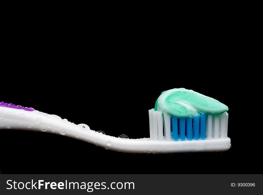Toothbrush with a glob of tooth paste