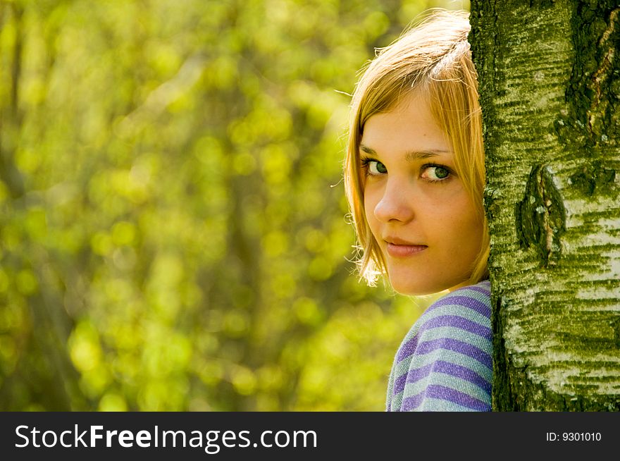 Portrait of young beautiful woman on nature