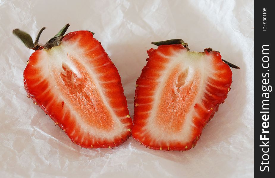 Two halves of the cut strawberry