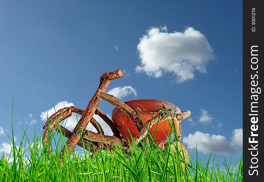 Wood bike with grass in front,blue sky background