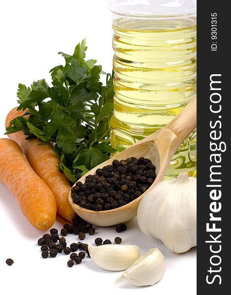 Carrots, parsley, garlic, black pepper and oil closeup. Carrots, parsley, garlic, black pepper and oil closeup