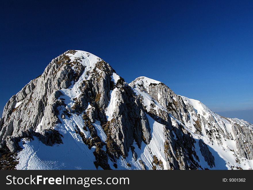 Ridge of Piatra Craiului Mountains - Romania, in a sunny April day. Ridge of Piatra Craiului Mountains - Romania, in a sunny April day