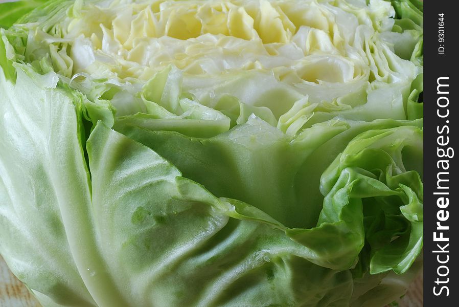 The cut white cabbage lies on a table