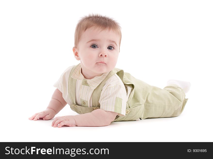 Portrait of adorable blue-eyes baby lying down over white