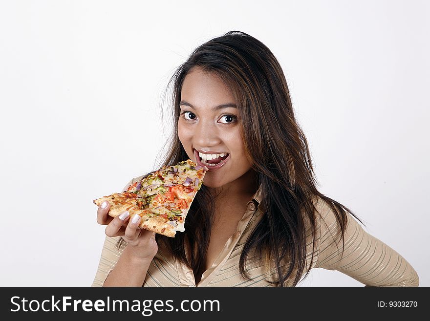 Sweet and pretty girl eating pizza slice