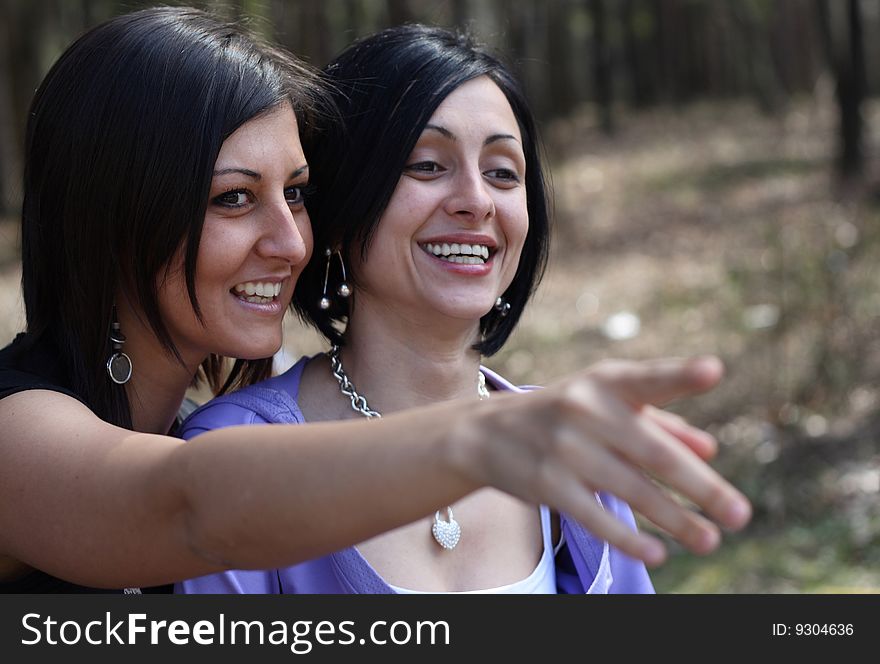 Two Girls Have Fun In The Park